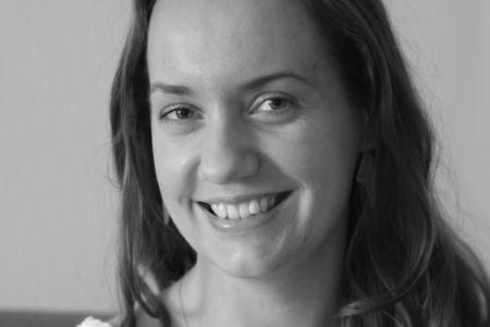 Image of Lena Borise smiling wearing a light colored blouse