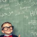 Baby in front of blackboard